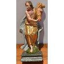 Alte Holzfigur mit Garbe